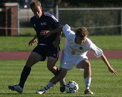 Jeffrey Johnson battles for possession.