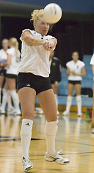 Jessica Plemel digs a Macalester attack.
