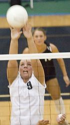 Junior Jami Moseng reaches for the block.