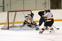 Goalie Erik Kraska makes the save on a close shot by a UW-Stout player.