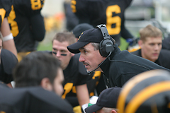 Coach Jay Schoenebeck talks with the offense.