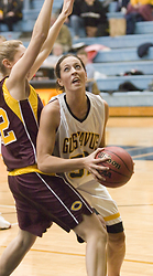 Junior Bri Monahan fights through a defender under the basket.