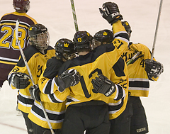 Keith Detlefsen and teammates celebrate his first period goal.