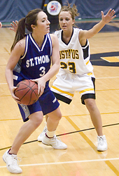 Ashley Raymo guards Chelsea Wirtz of St. Thomas.