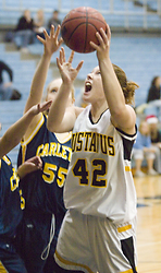 Vicky Peterson gets fouled as she goes up to score.