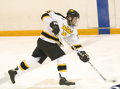 Senior Keith Detlefsen fires a shot at the net from near the blue line.
