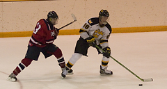 Junior John Arundel moves the puck around near the blue line.