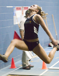 Senior Blythe Bittman exerts maximum effort to record a winning distance in the long jump.