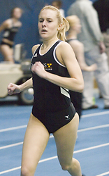 Mollie Lager pushes toward a win in the mile run.