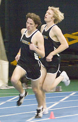 Nate Barten leads John Leaf around the turn in the men's mile.