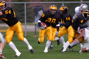Loren Havemeier breaks through a hole on his way to returning a punt 79 yards for the game's first touchdown