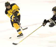 Eric Lindquist shoots the puck.