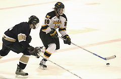 Junior John Arundel moves the puck across center ice