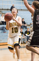 Senior Missy Mills drives through the lane for a lay-up.