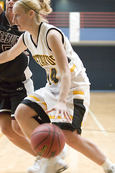Senior Sara Boldt attempts to find room underneath the basket.