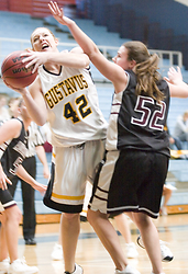 Sophomore Vicky Peterson fights through traffic for the hoop.