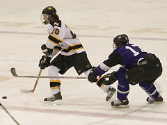 Jon Keseley passes the puck at center ice.