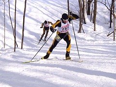 Erich Ziegler uses the hill to make his move on St. Olaf's Karl Nygren.