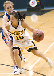 Senior Missy Mills drives toward the hoop from the perimeter.