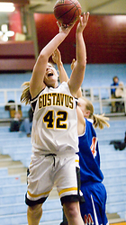 Sophomore Vicky Peterson fights past a defender for the shot.