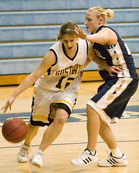 Jess Vadnais drives past Bethel's Jen Ahlberg.  Both players passed milestone scoring marks in Monday's game.