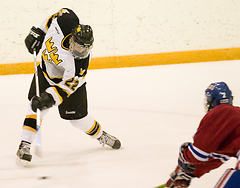 Tim Ornell plays the puck in front of Saint John's goalie Adam Hanna.