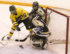 Jessie Doig tries to get the puck past Ole goaltender Shannon Herrick.
