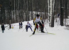 Daw uses the hills on the course at Mount Itasca to get an advantage on another skier.