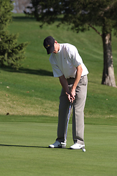 Eric Tone putts for par on the 13th hole.