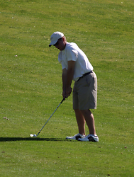 Jordan Hawkinson prepares to hit a fairway shot.