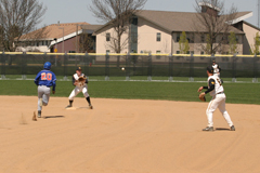 Nate Ruff flips the ball to Mike DesLauriers to get the lead runner out.