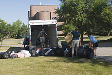Volunteers load boxes and bags of collected blankets destined for Mississippi.