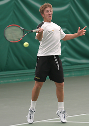 Bryan strokes a forehand.