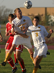 Kroog heads the ball to a teammate against Saint John's