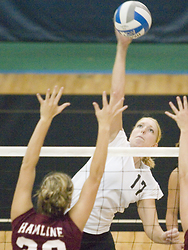 Andrea Kron goes high for a kill.