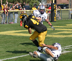 Sophomore wide receiver Chad Arlt breaks through a Tommy tackle to score the Gusties' lone touchdown.