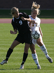 Alison Dittmer battles a Wildcat for the ball.