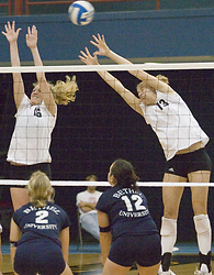 Jessica Plemel (left) and Meghan Gehring (right) attempt to block a Bethel shot.