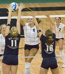 Becca Thompson tries to get the ball through.