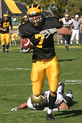 Senior wide receiver Kerry Zajicek breaks a tackle en route to a 97-yard touchdown reception against the Oles.