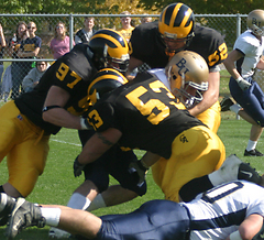 Ted Aleckson (97) and Nick David (53) wrap-up a Bethel ball-carrier.