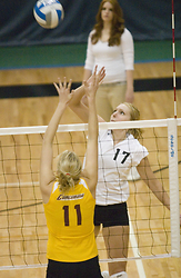 Andrea Kron knocks the ball back over to the Concordia side.