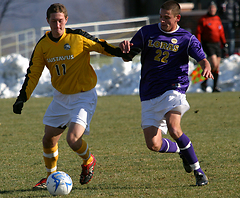 Fraser Horton works the ball through the midfield for Gustavus.