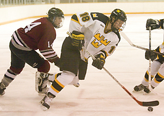 John Arundel moves the puck down the ice.
