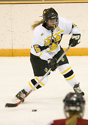 Margaret Dorer looking to pass the puck.