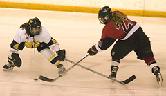 Claire Opsahl tries to defend a Falcon shot.