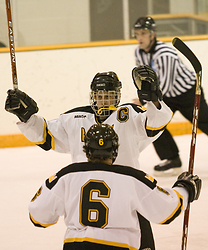 Hosfield celebrates his game-winning goal with Cody Mosbeck (#6).