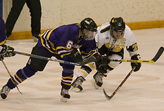 Andrea Peterson (right) scored three assists while keeping Nicole Grossman (left) without a point.