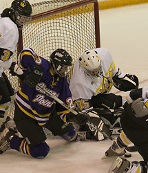 Sarah Windhorst (35, white) made 18 saves in net to pick up the victory.