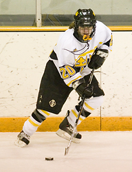 Junior Molly Doyle looks to make a pass from along the boards.